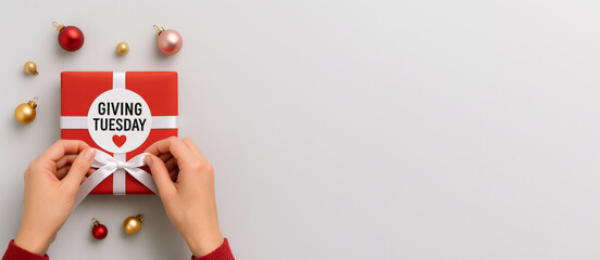 Giving Tuesday gift on white background for holiday donation concept