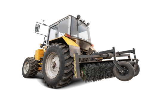 Tractor equipped with a large sweeping brush operates in an isolated area, efficiently clearing dust and debris from the ground.