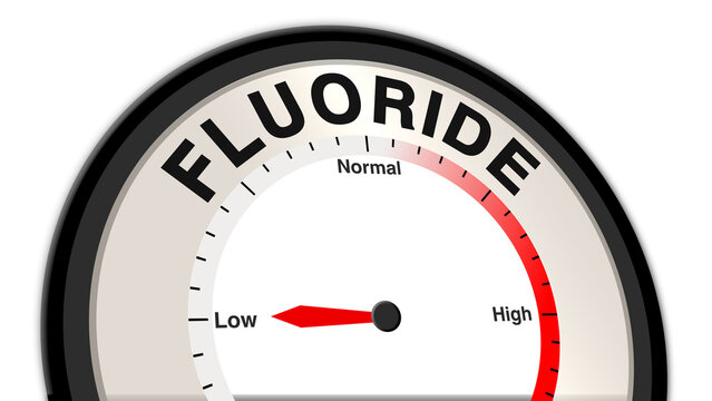 Fluoride at low levels on a barometer or tachometer, showing symptoms like weakened teeth, bone fragility, and dental cavities, indicating potential deficiency and the need for fluoride supplement