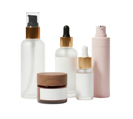 Assorted Skincare Product Bottles and Jars with Gold Accents and Transparent Background