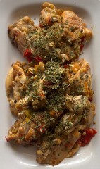 Smashed chicken on white plate upper view