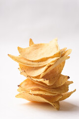 Tortilla chips made from baked corn for Mexican food snack on white background