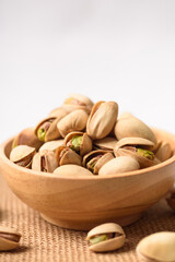 Roasted pistachios with salt, healthy snack on white background