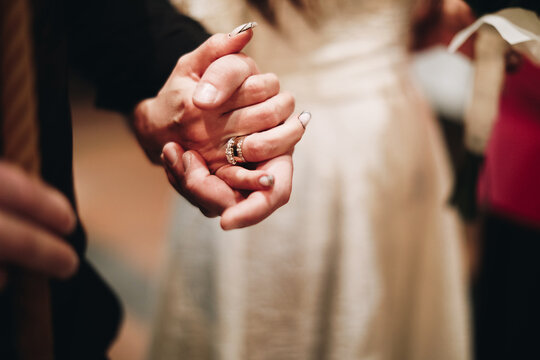hands of the groom and bride