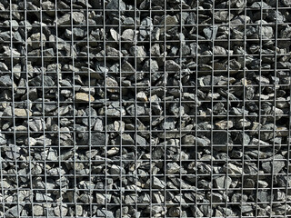 Gabion, texture, background. Gabion net frequent part (design). New technologies in the manufacture of retaining walls and fences. Landscaping. Fencing decorative elements