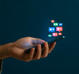 Social media engagement : A hand cradles a smartphone, illuminated by a constellation of digital notifications.