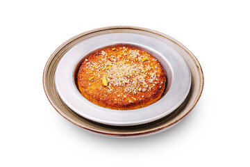 Delicious dessert of basbousa topped with nuts served on a silver plate