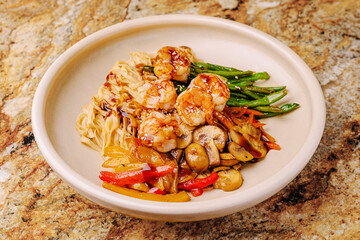 Delicious shrimp stir-fry served on a smooth marble table