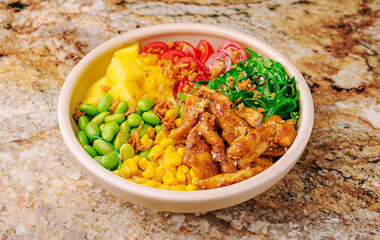 Fresh and colorful chicken bowl with vegetables and fruits for a healthy meal