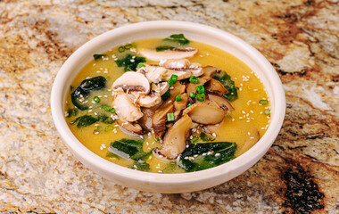 Delicious miso soup with mushrooms and seaweed served in a bowl