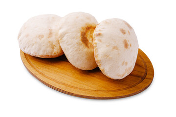 Freshly baked pita bread served on a wooden platter for sharing at dinner