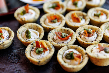 Mini canapes with cream and vegetables