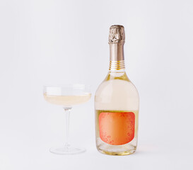 Celebrate with sparkling wine and a stylish glass in a minimal setting