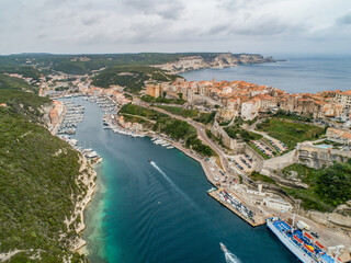 Aerial view marina cape Bonifacio south Corsica France citadel on rocky promontory on wild white limestone cliffs