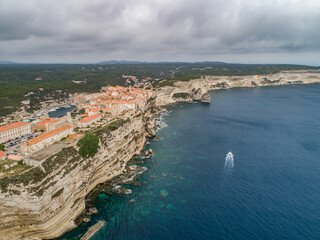 Aerial view marina cape Bonifacio south Corsica France citadel on rocky promontory on wild white limestone cliffs
