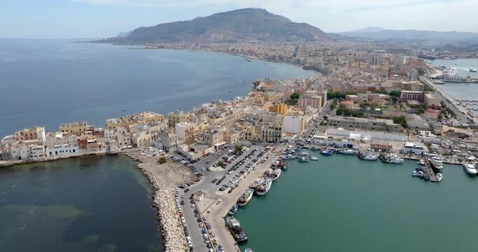 Aerial view of Trapani, Sicily, Italy. It is a Sicilian city with a port overlooking the Mediterranean Sea. Mount Erice dominates the town in the background.