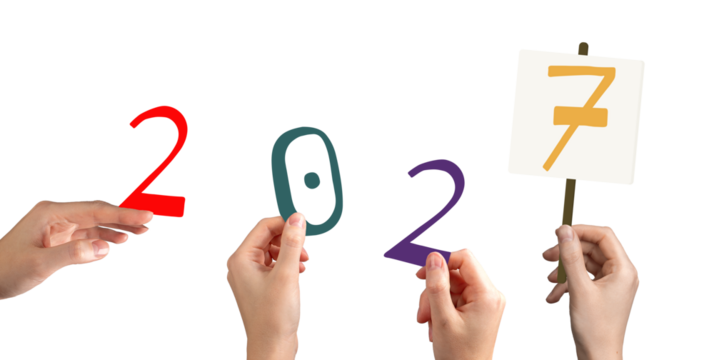 Hand holding colorful 2027 number in festive New Year celebration. Bright multicolor typography