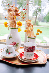 Baby shower setup with pastel balloons, cake and wrapped gifts on a cozy table, soft natural light and copy space—perfect for invitations and social posts.