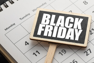 BLACK FRIDAY words on a chalkboard and black background. Time for promotions in salons and online.