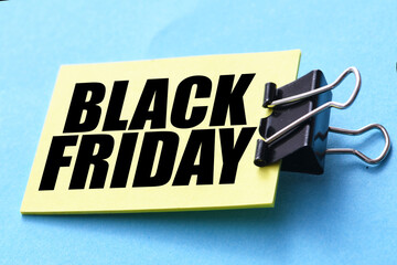 Black Friday words written on a piece of paper. Time for promotions and sales in stores.