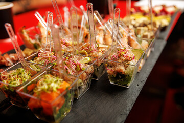 Colorful mini salads served in plastic cups
