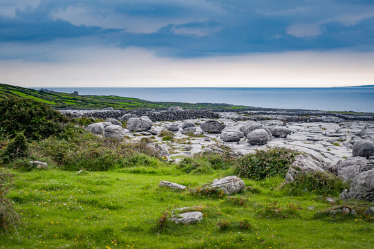 Limestone coast with ocean. Exposed karst limestone bedrock at the Burren National Park. Ireland.