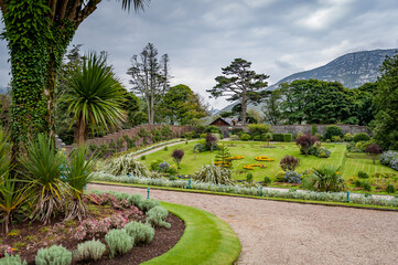 Obraz premium Pathway through Victorian Walled Garden at Kylemore Abbey, Ireland.