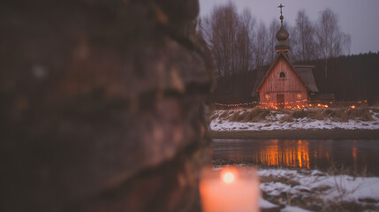 Celebration of Epiphany Day in an Orthodox Christian setting near a snowy landscape with a small wooden church and lit candles at dusk