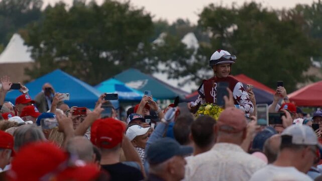 A Jockey On A Horse In A Crowd Of Spectators During Pennsylvania Derby 