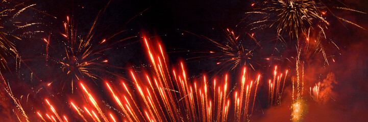 New Year, New Year's eve or festival celebration holiday greeting card long - Red firework fireworks display pyrotechnics on night sky background