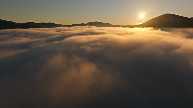 Majestic Sunrise Illuminating the Vast Sea of Fog Below