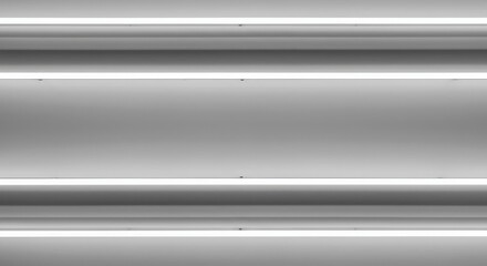 Close up of modern ceiling with four bright neon fluorescent lamps providing illumination for interior space du the daytime hours in office.