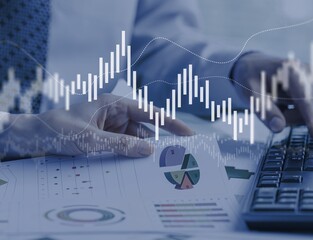 Business meeting with documents and graphs on desk