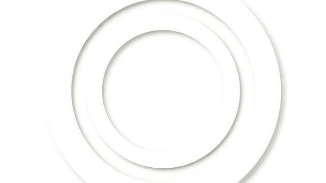 Abstract image of concentric white rings casting subtle shadows on a bright background