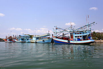 Fishing boats moored at the pier After the Department of Fisheries issued a law regulating fishing in Thailand