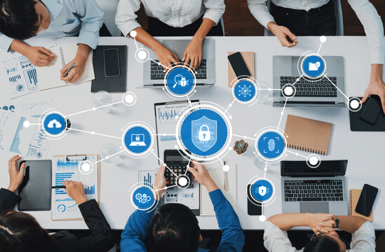 Top view analyst team utilizing BI Fintech to analyze financial data at table in meeting room. Analytic BI dashboard power on paper for business insight and strategic marketing planning. Prudent Amity