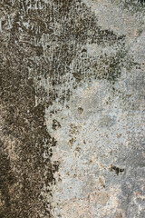 Real weathered concrete wall with a heavy grunge texture. Featuring stained, dirty and distressed surface, perfect for urban backgrounds, edgy design, dramatic overlay, textural element.