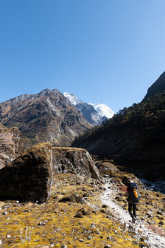Rear view of a climber trekking along a footpath towards Mera Peak, Nepal
