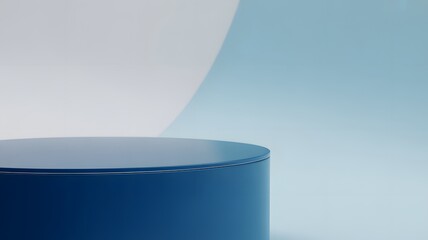 Blue cylindrical pedestal against soft blue and white background