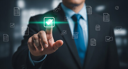 Businessman pressing a glowing green button with a checkmark icon