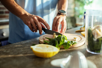 Adult man preparing food in kitchen