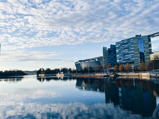 Modern Riverside Architecture with Reflections on a Clear Day