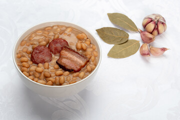Beans with sausage and pork bacon
