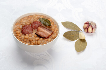 Beans with sausage and pork bacon