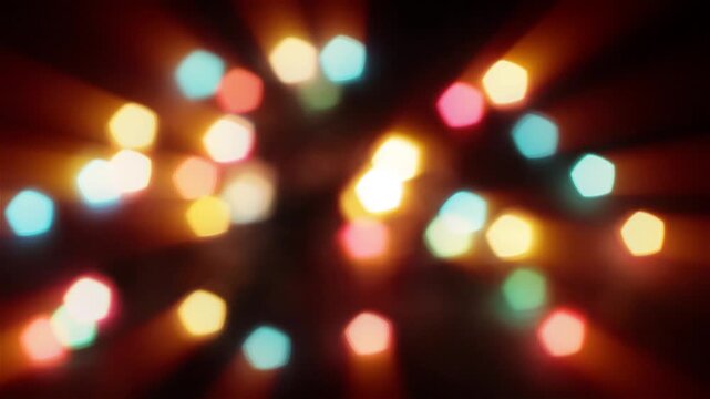 Abstract colorful bokeh lights with a zoom effect on a black background. Festive holiday Christmas party glowing motion animation.