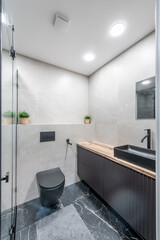 Interior of Luxury chromed shower in modern marble bathroom. Spacious bathroom