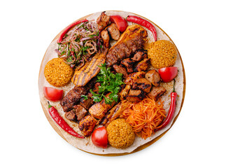 Delicious mixed grill platter with meat, rice, and fresh vegetables