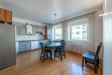 Classic Kitchen Interior and Dinning Table. Wooden Floor, Oven, Kettle