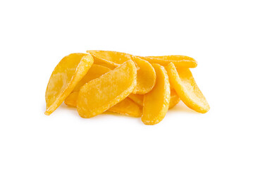 frozen potato wedges slices are piled together on a clean white surface