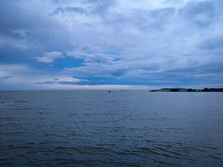 selective focus picture of sea in the stormy weather. surrounded by dark clouds and high waves
